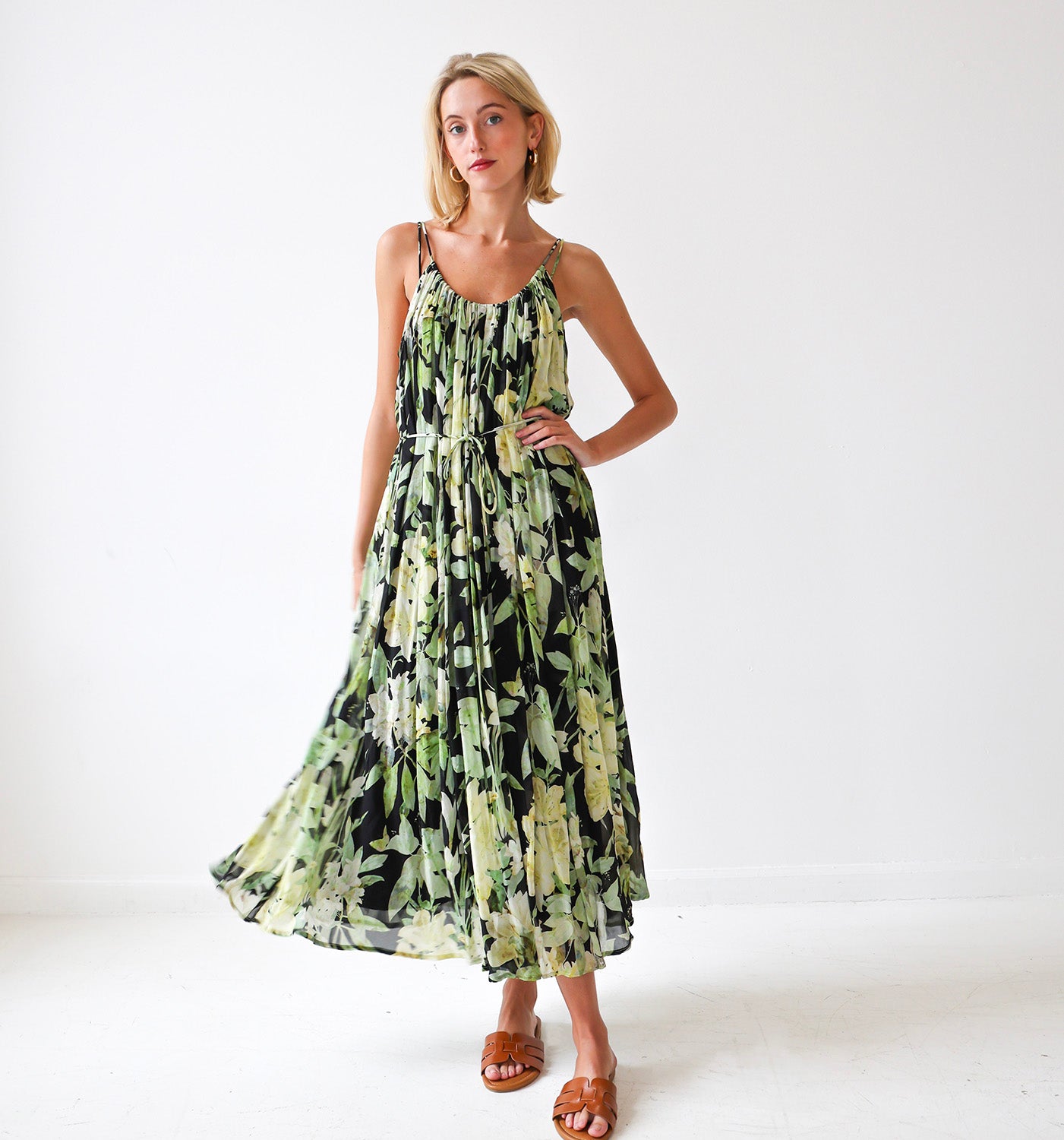 Woman wearing a floral dress on a white background