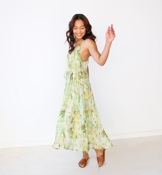 Woman wearing a floral dress on a white background